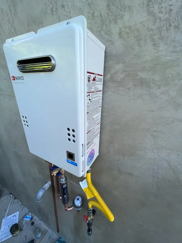 Tankless water heater installation for Tudor Village homes